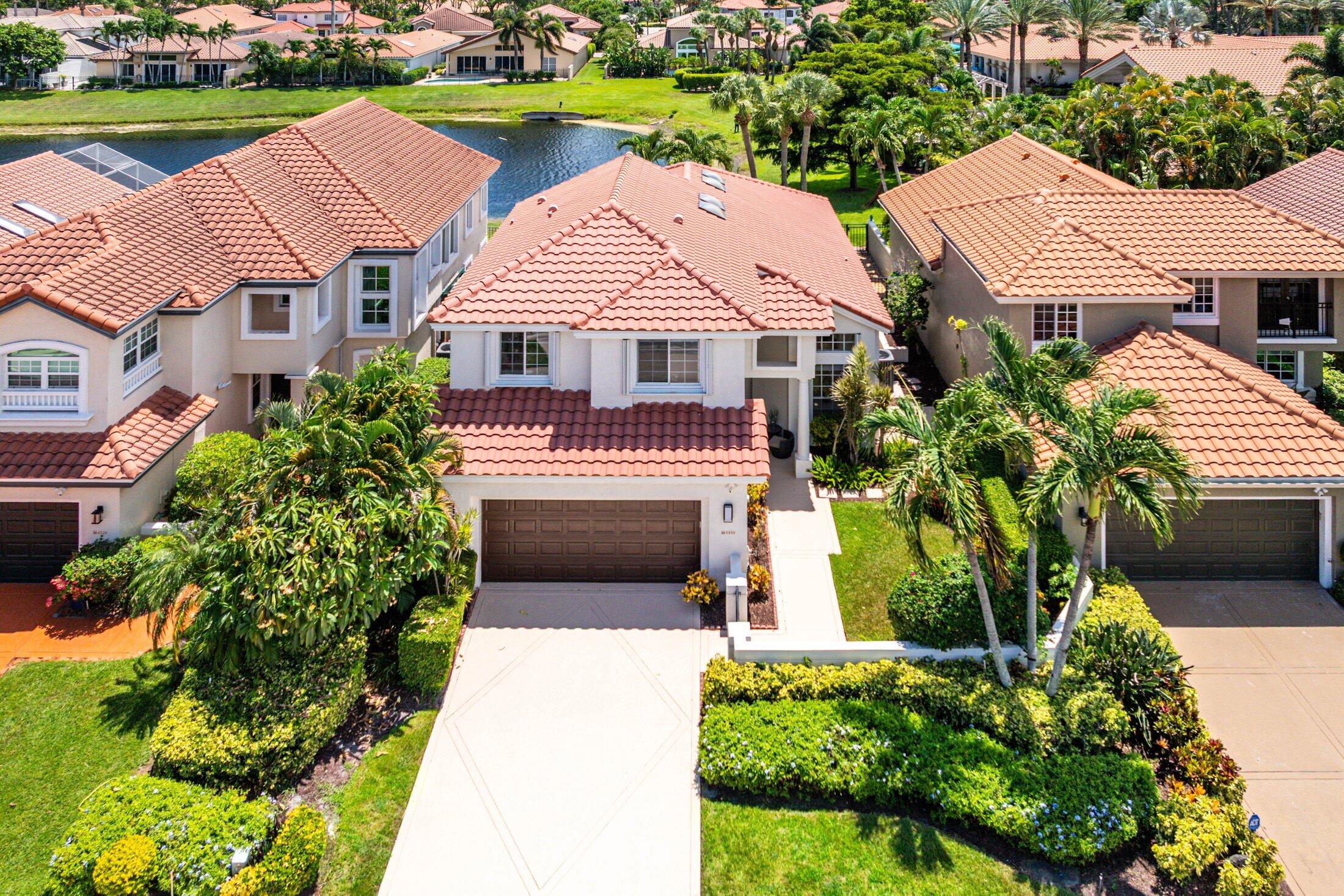 6334 Northwest 24th Street Boca Raton, FL 33434 - Photo 2 of 56 a aerial view of a house with a yard and potted plants