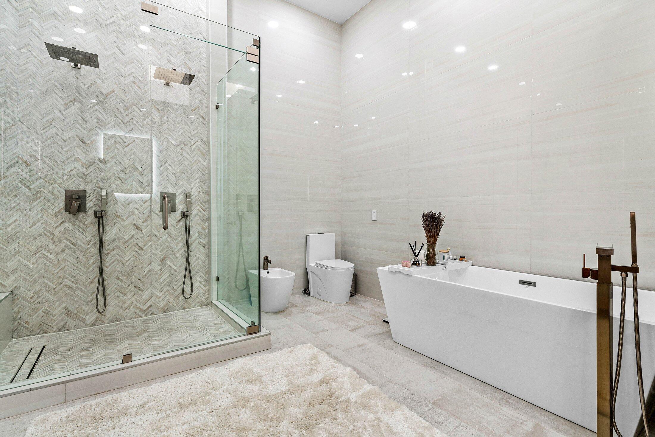 6334 Northwest 24th Street Boca Raton, FL 33434 - Photo 23 of 56 a spacious bathroom with a bathtub and shower