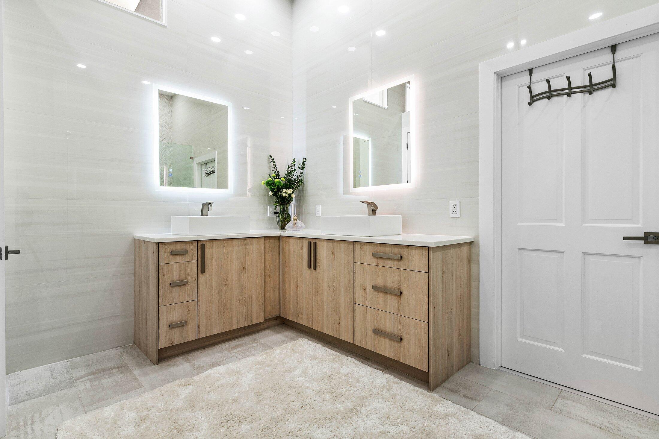 6334 Northwest 24th Street Boca Raton, FL 33434 - Photo 25 of 56 a bathroom with a granite countertop sink and a mirror
