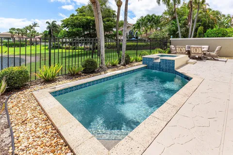 a bathroom with a double vanity sink toilet and shower