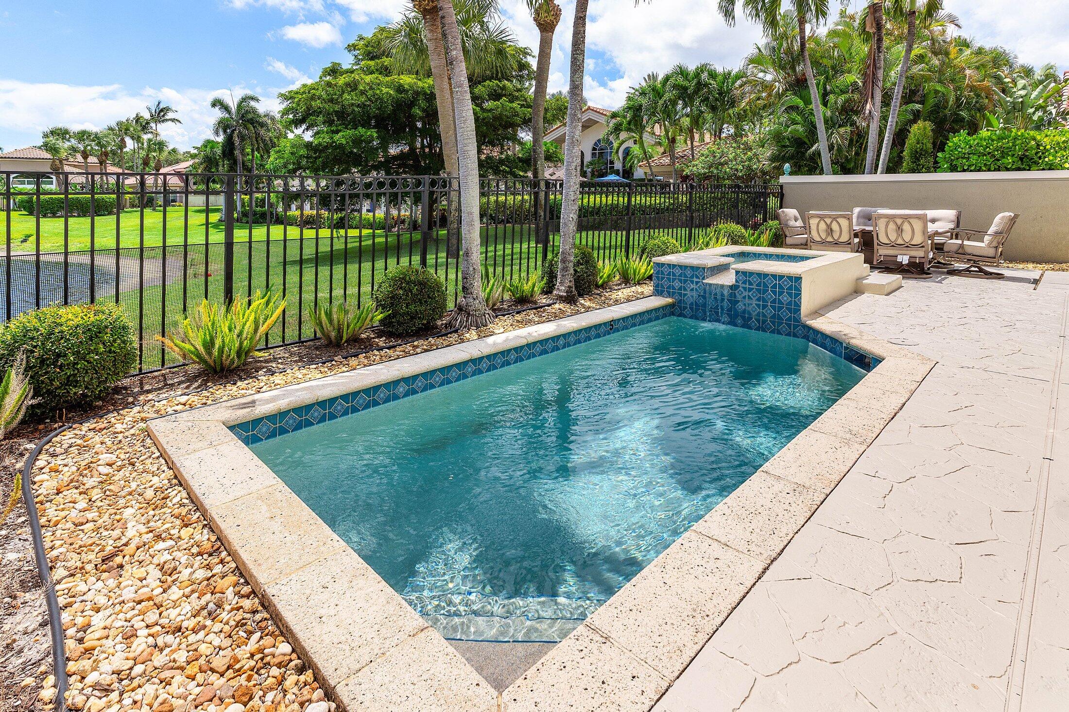 6334 Northwest 24th Street Boca Raton, FL 33434 - Photo 28 of 56 a view of a garden with a sitting area