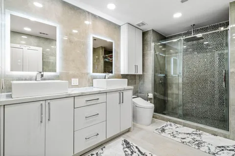 an aerial view of a house with a garden and swimming pool