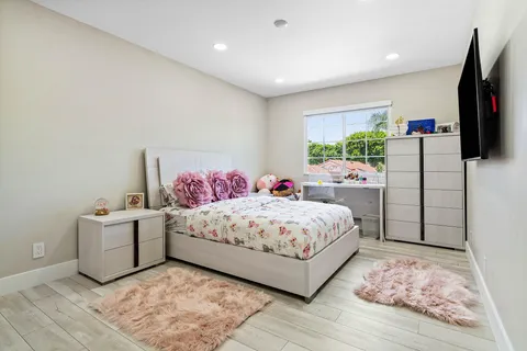 an aerial view of multiple houses with yard