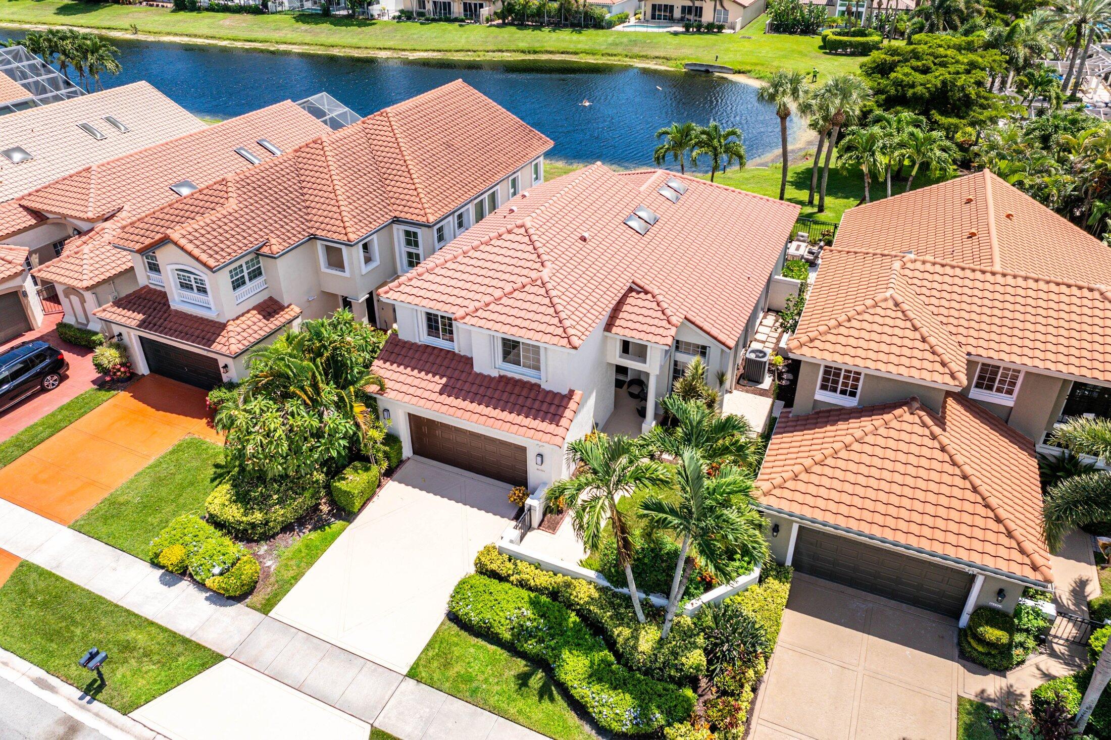 6334 Northwest 24th Street Boca Raton, FL 33434 - Photo 35 of 56 an aerial view of a house with a garden and lake view