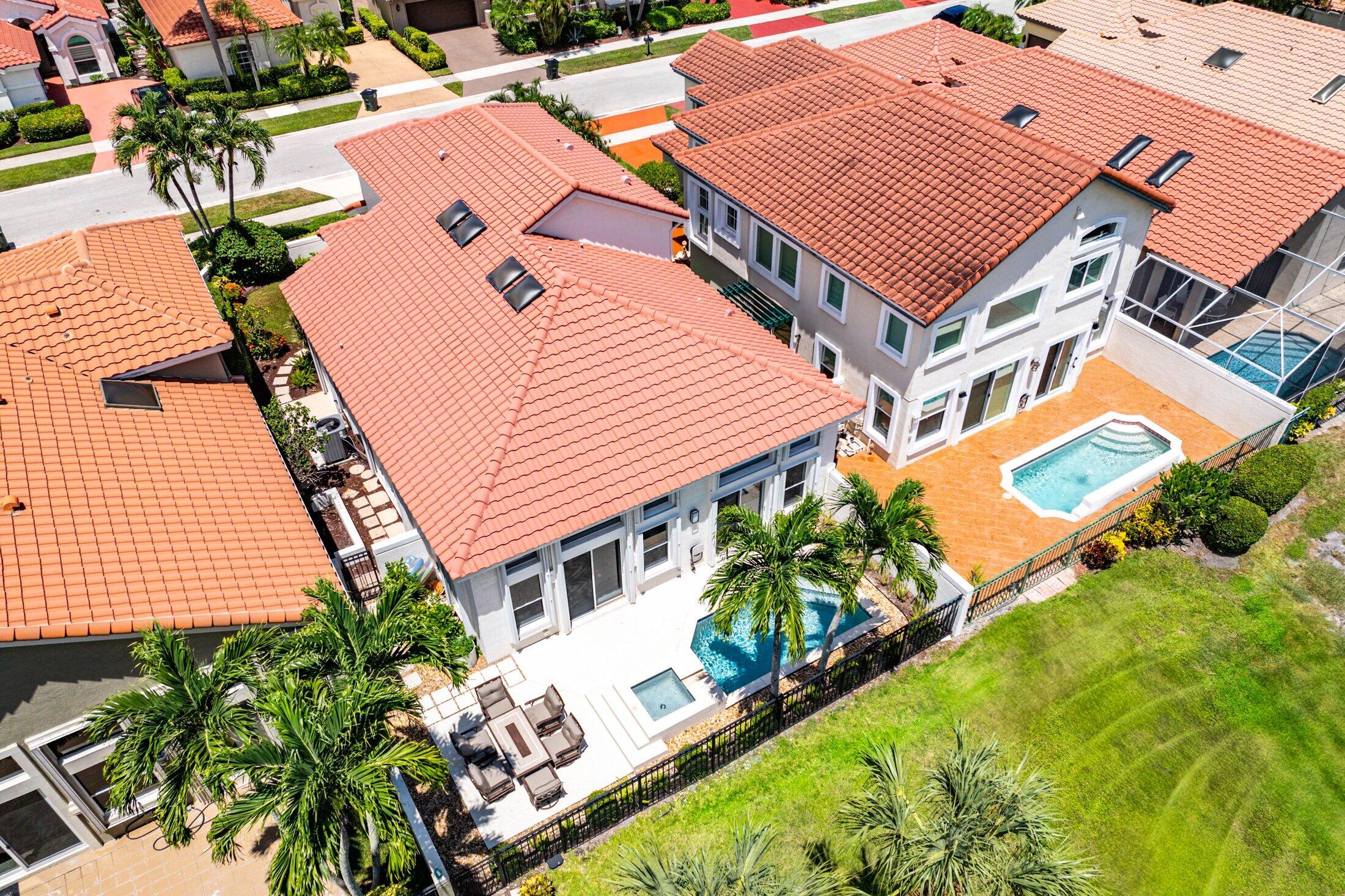 6334 Northwest 24th Street Boca Raton, FL 33434 - Photo 36 of 56 an aerial view of a house with a garden and swimming pool