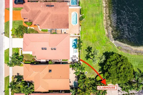 an aerial view of residential houses with outdoor space and street view