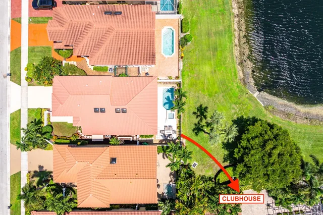 an aerial view of residential houses with outdoor space and street view