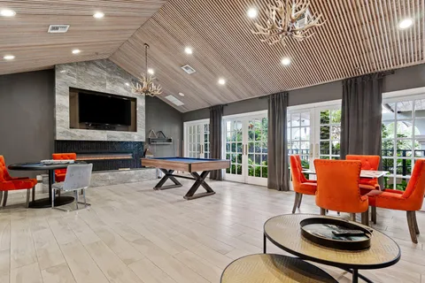 a view of a swimming pool with a lounge chairs