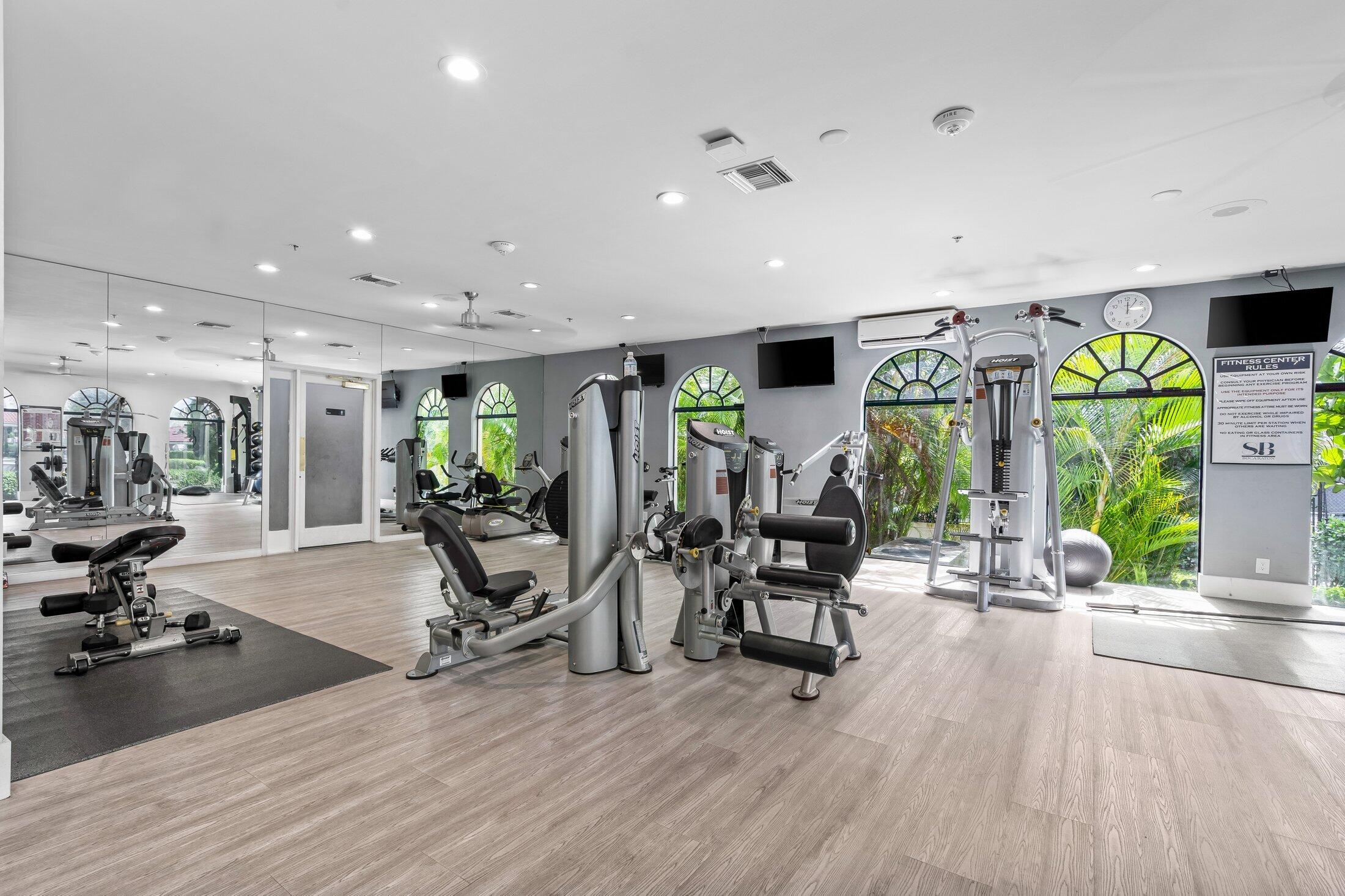 6334 Northwest 24th Street Boca Raton, FL 33434 - Photo 51 of 56 a view of a room with gym equipment and large windows