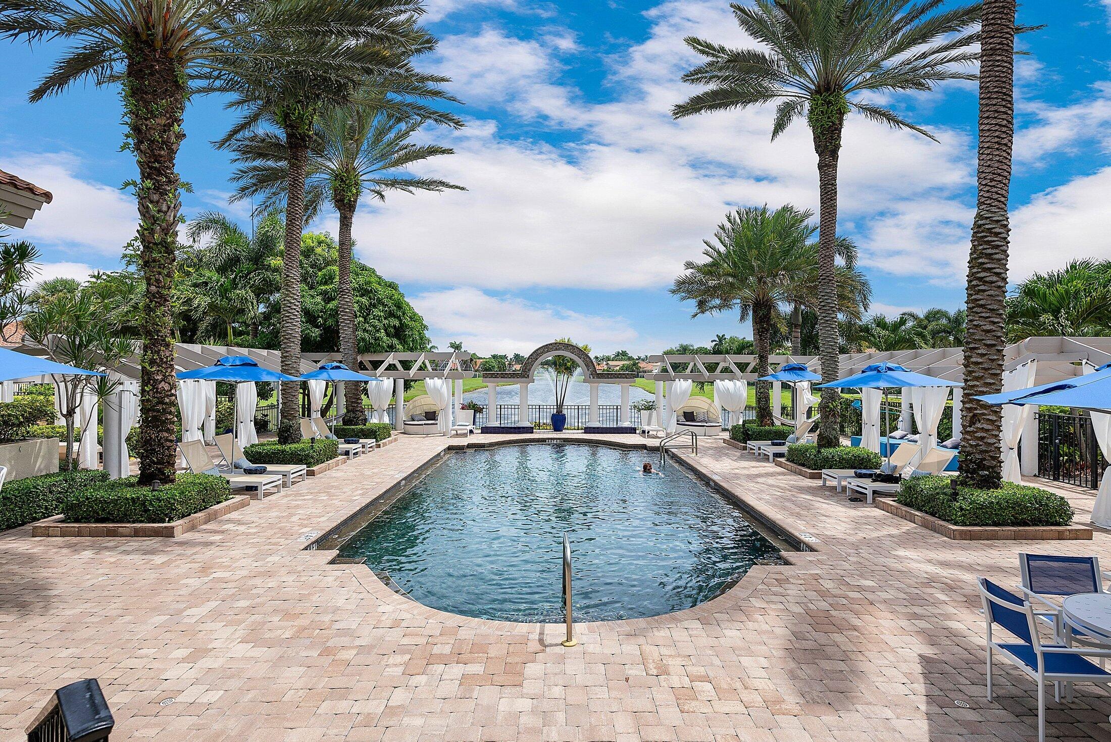 6334 Northwest 24th Street Boca Raton, FL 33434 - Photo 53 of 56 a view of a swimming pool with a lounge chairs