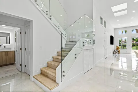 a view of entryway and hall with a living room