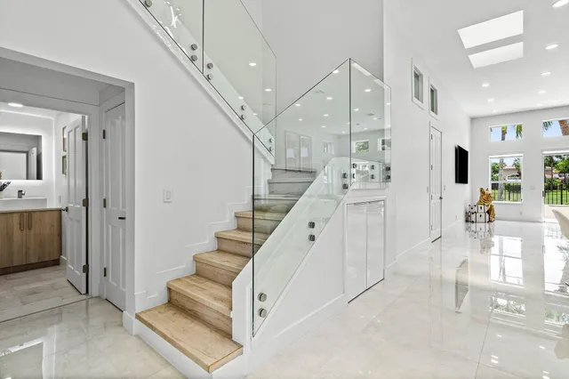a view of entryway and hall with a living room