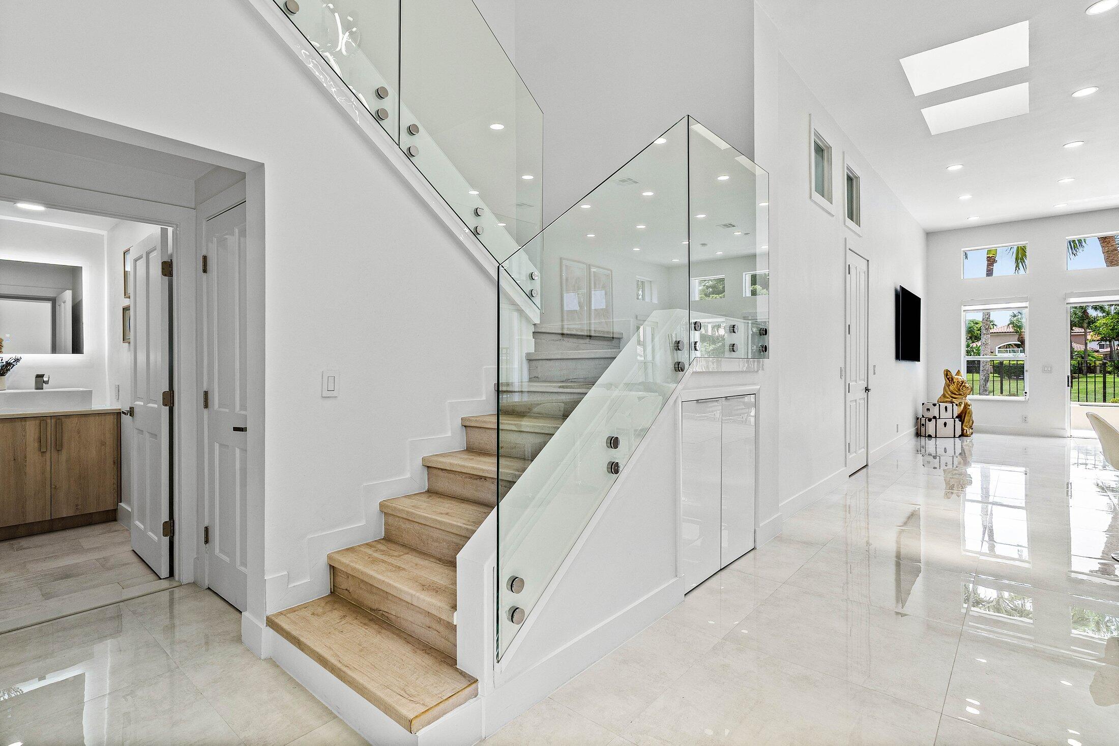 6334 Northwest 24th Street Boca Raton, FL 33434 - Photo 6 of 56 a view of entryway and hall with a living room