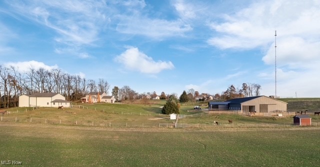 8995 Ridge Road Wooster, OH 44691 - Photo 40 of 50 View of green lawn featuring a view of rural / pastoral area, an outdoor structure, and a pole building