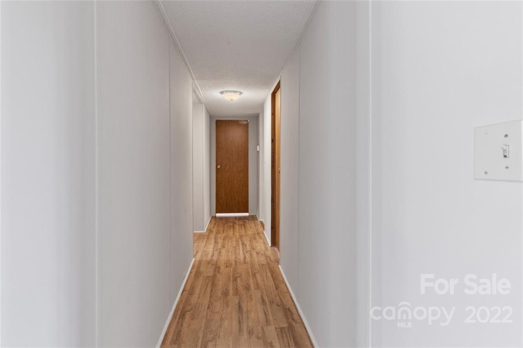 7237 Long Island Road Catawba, NC 28609 - Photo 15 of 36 a view of a hallway with wooden floor
