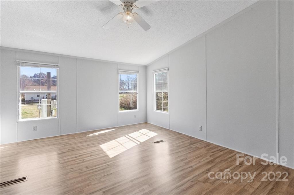 7237 Long Island Road Catawba, NC 28609 - Photo 16 of 36 a view of an empty room with window and wooden floor