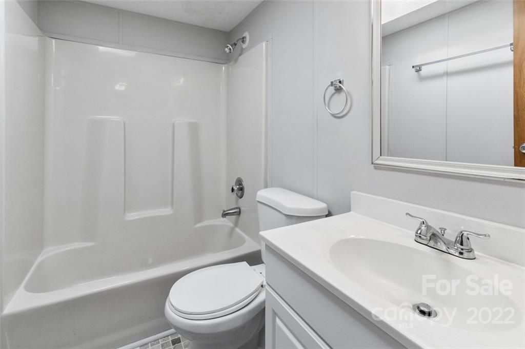 7237 Long Island Road Catawba, NC 28609 - Photo 23 of 36 a bathroom with a sink a toilet and a bathtub