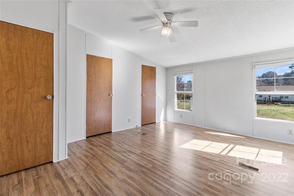 7237 Long Island Road Catawba, NC 28609 - Photo 27 of 36 wooden floor in an empty room with a window