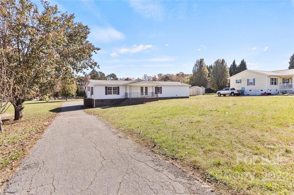 7237 Long Island Road Catawba, NC 28609 - Photo 33 of 36 a view of a house with a yard and trees