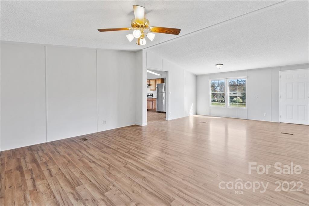 7237 Long Island Road Catawba, NC 28609 - Photo 6 of 36 a view of an empty room with a window and wooden floor