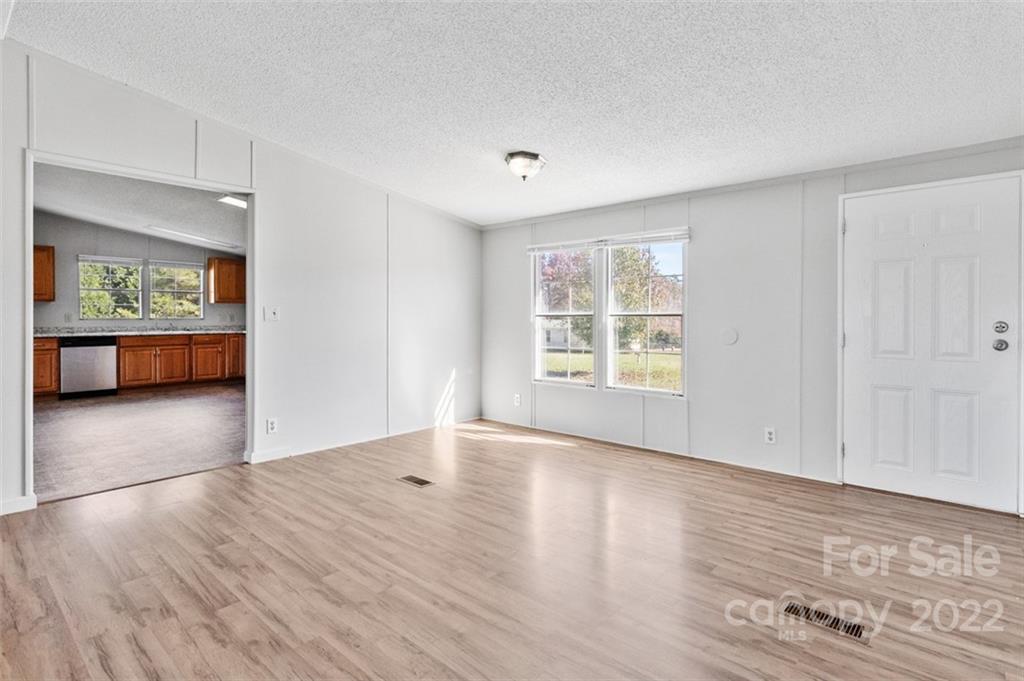 7237 Long Island Road Catawba, NC 28609 - Photo 9 of 36 wooden floor in an empty room with a window