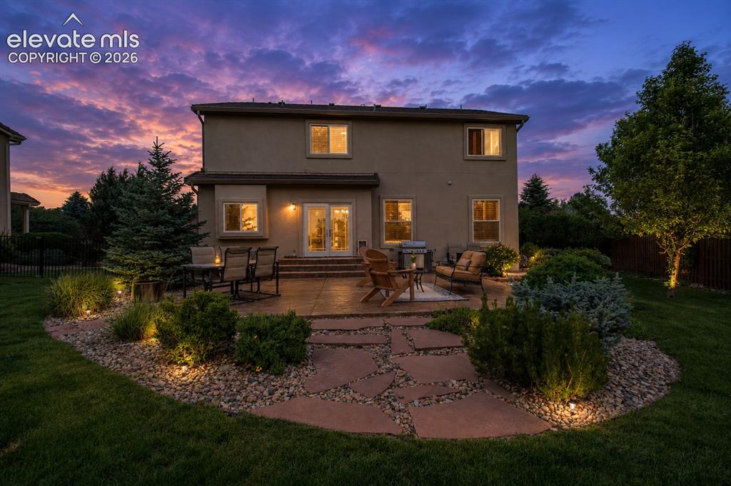 789 Capeglen Road Colorado Springs, CO 80906 - Photo 4 of 46 Large concrete stamped patio with views of the mountains and Colorado Sunsets