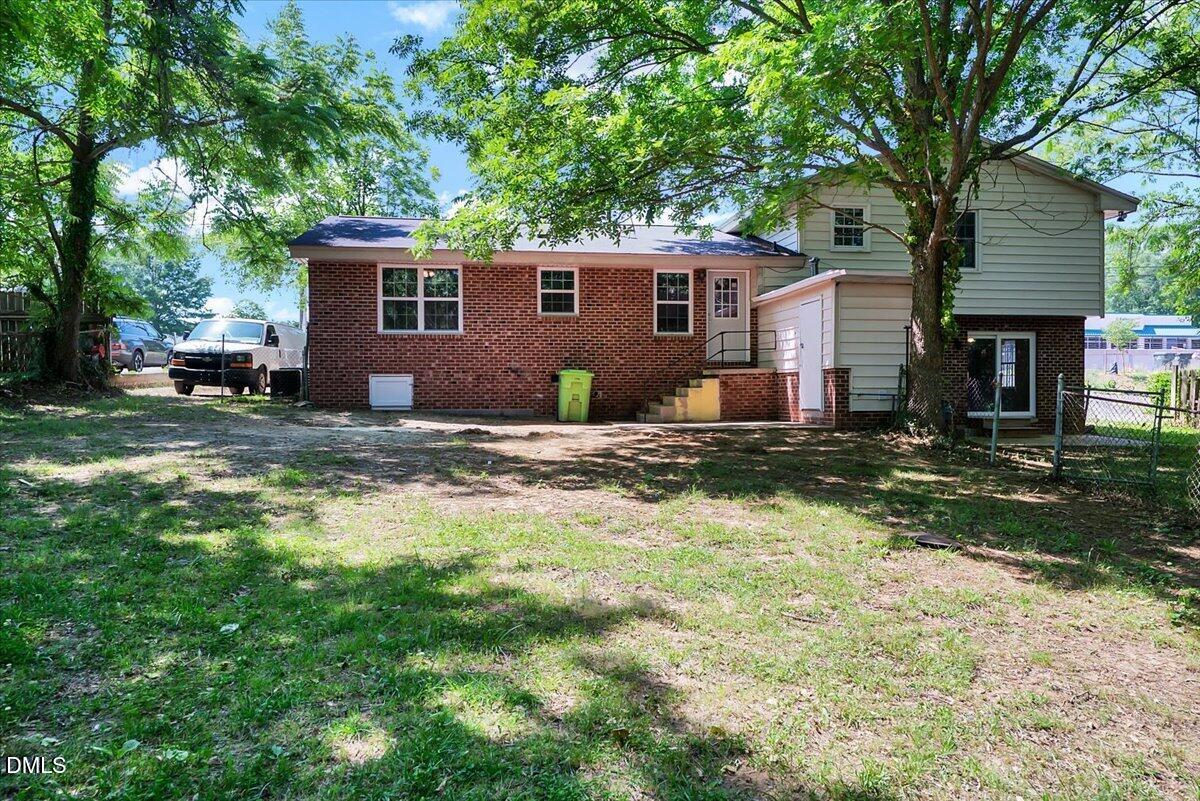 3408 Atlantic Avenue Raleigh, NC 27604 - Photo 19 of 48 a view of a house with a yard