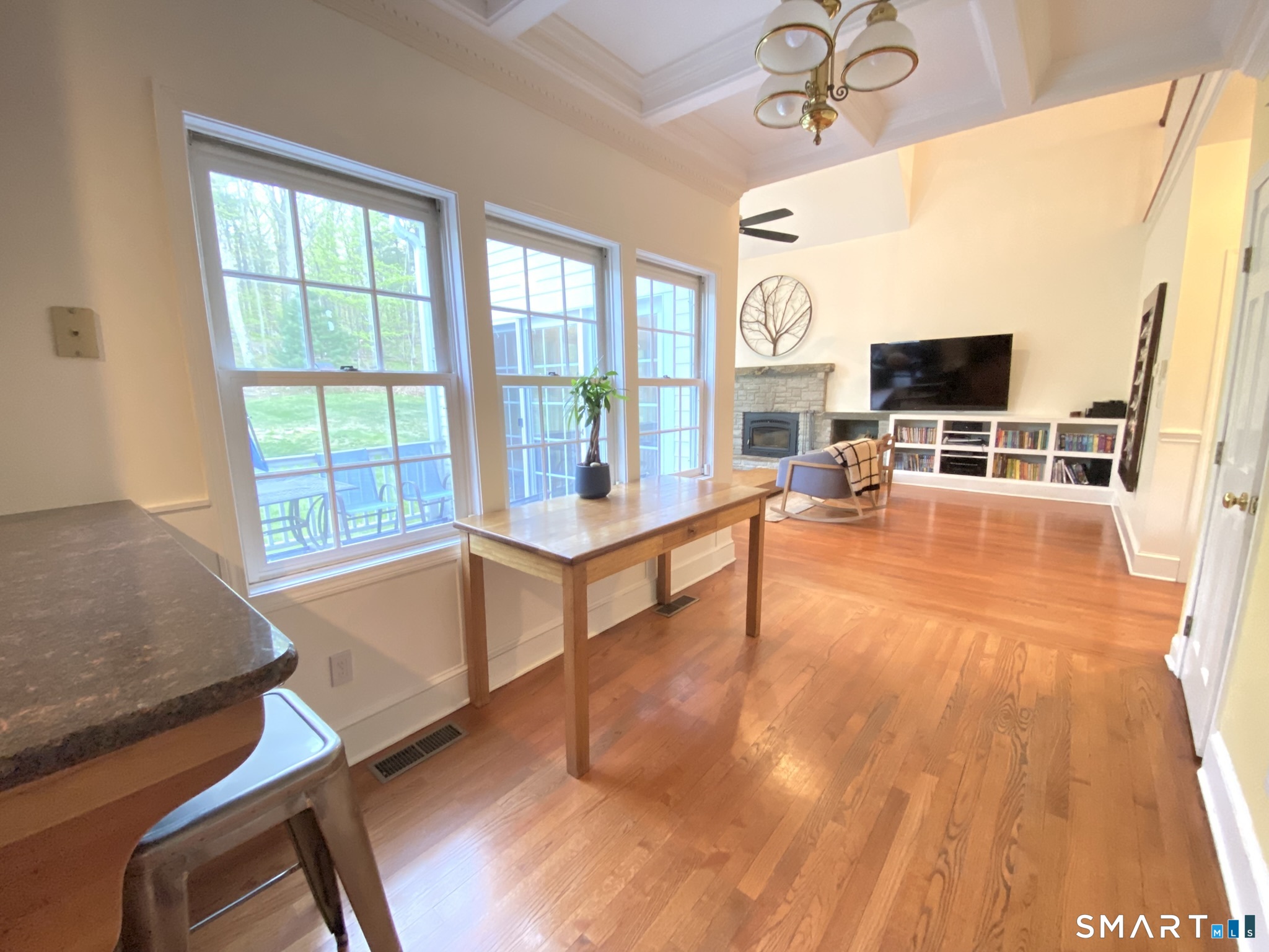 12 Carriage Hill Road Woodbridge, CT 06525 - Photo 11 of 24 a living room with furniture and flat screen tv