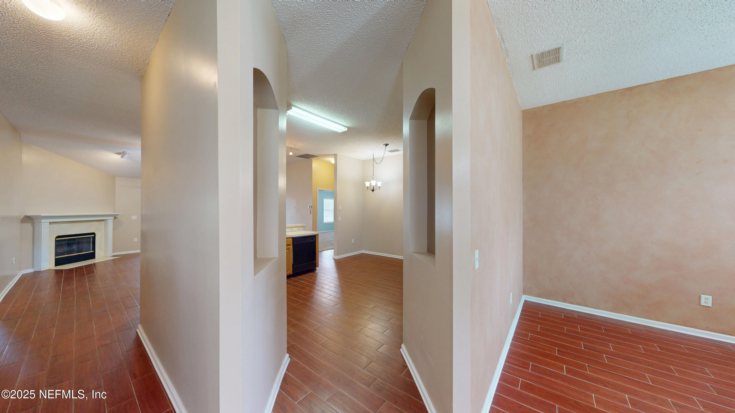 2933 Turning Leaf Lane Jacksonville, FL 32221 - Photo 11 of 22 a view of a hallway with wooden floor and staircase