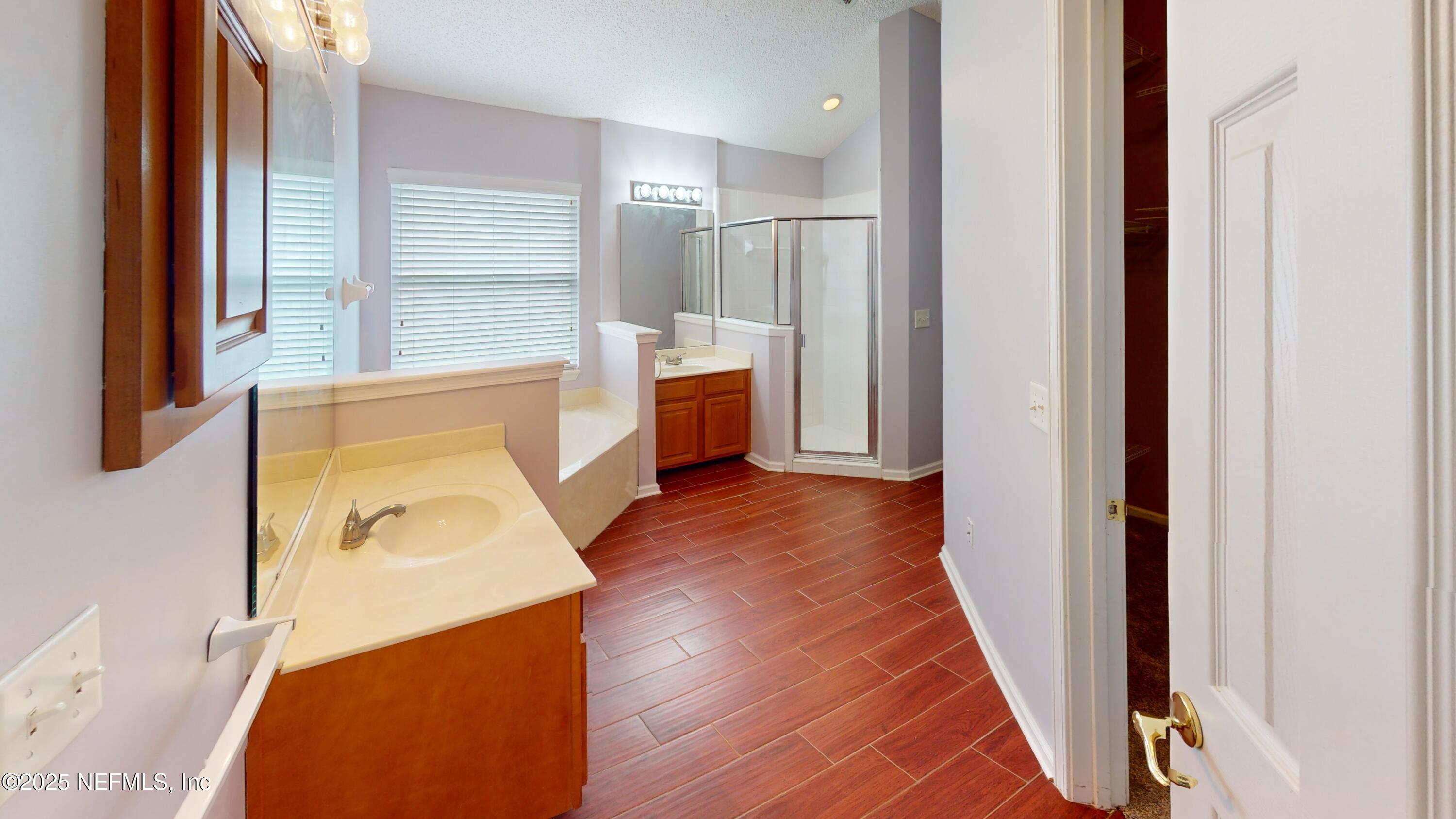 2933 Turning Leaf Lane Jacksonville, FL 32221 - Photo 14 of 22 a view of walk in closet with wooden floor