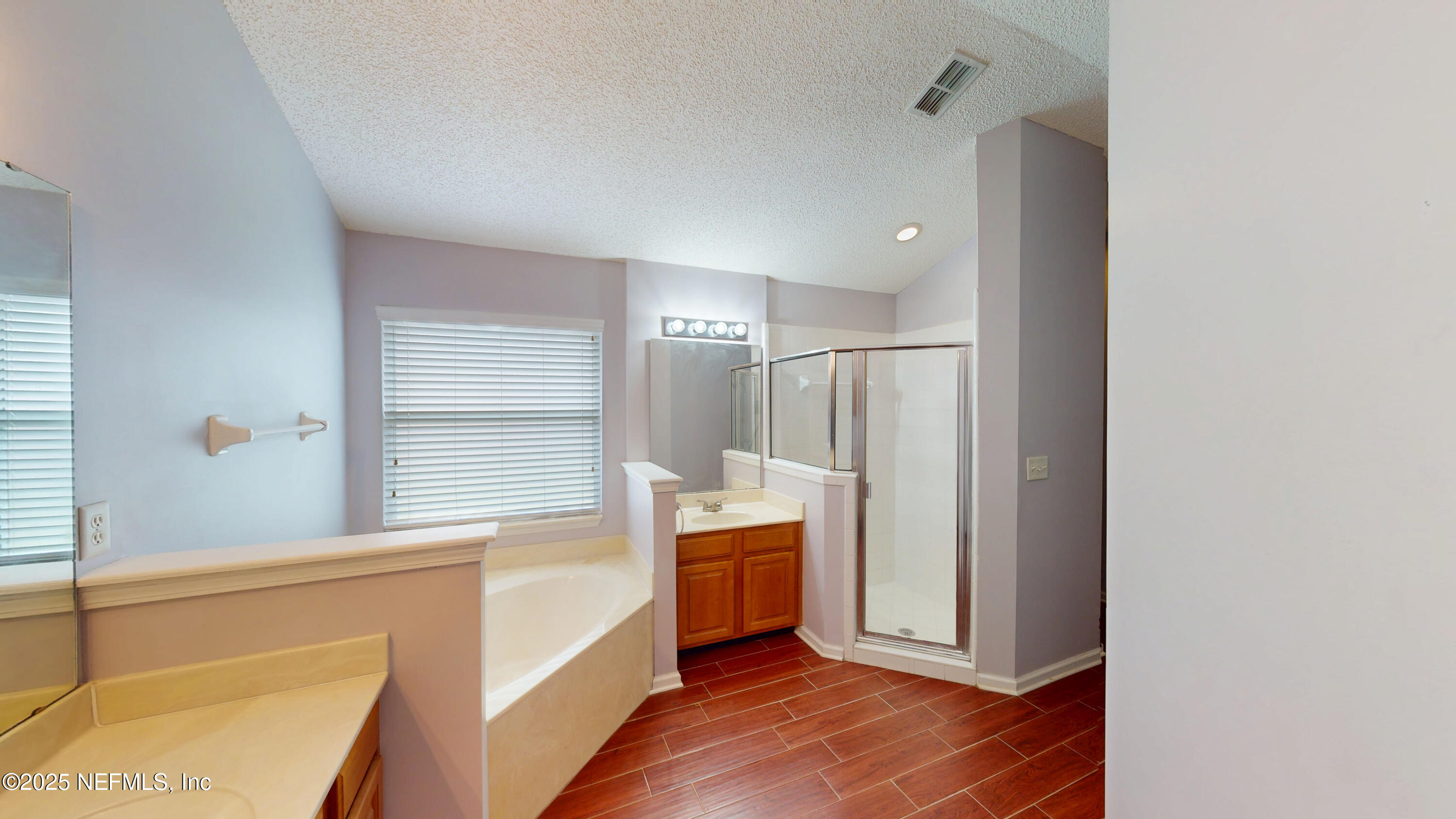 2933 Turning Leaf Lane Jacksonville, FL 32221 - Photo 16 of 22 a kitchen with white cabinets and white appliances