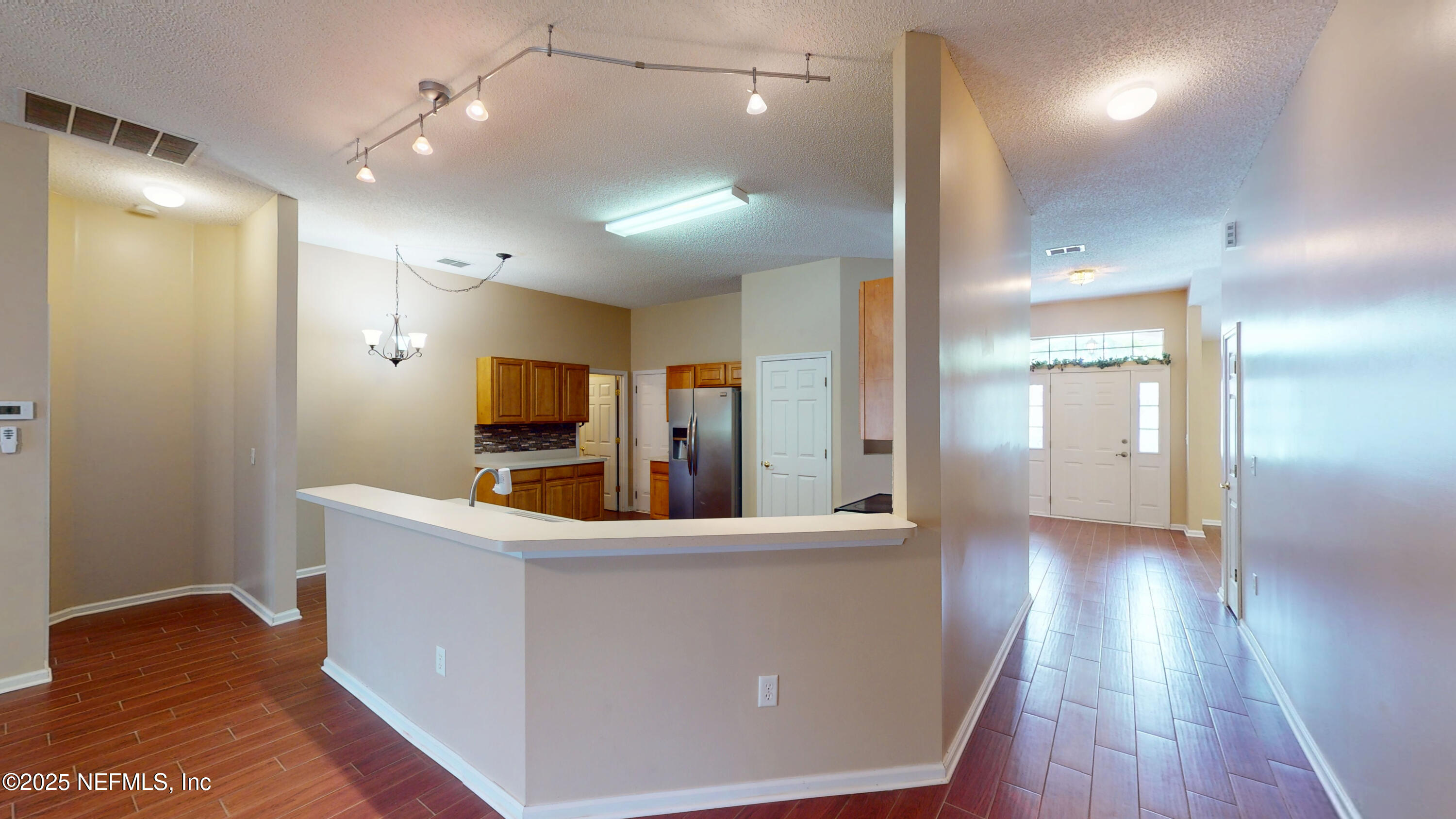 2933 Turning Leaf Lane Jacksonville, FL 32221 - Photo 5 of 22 a view of a room with wooden floor and staircase