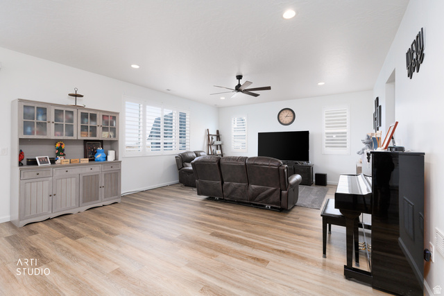 540 Lefty Lane Tooele, UT 84074 - Photo 10 of 48 Living area featuring light wood-style flooring, a ceiling fan, and recessed lighting