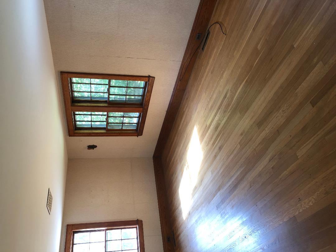 86 Menemsha Cross Road Chilmark, MA 02535 - Photo 7 of 23 a view of an empty room with a window