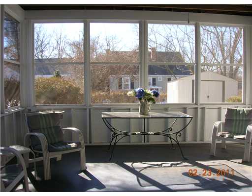 26 Colonial Road Bristol, RI 02809 - Photo 8 of 8 Exterior Front. inside screen room