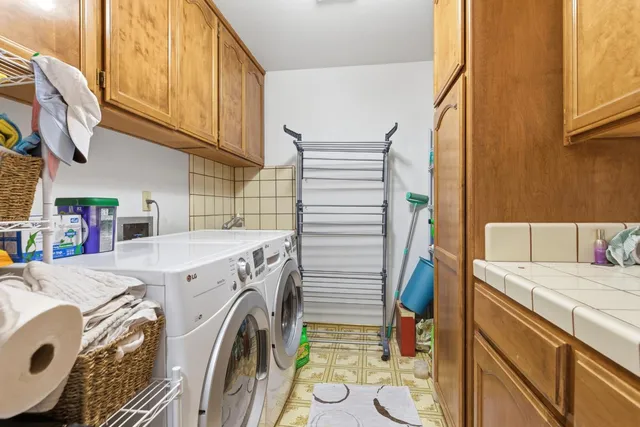 a utility room with dryer and washer