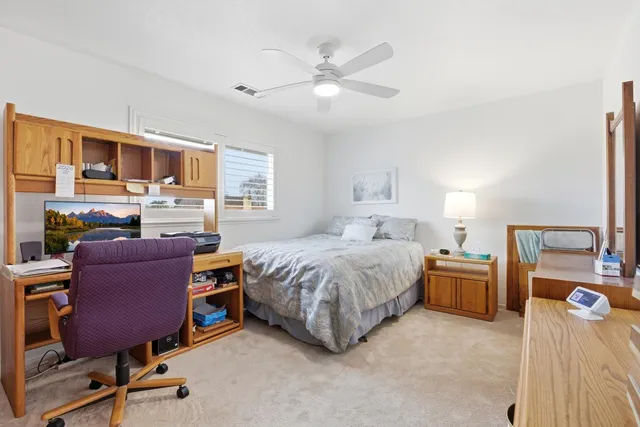 a bedroom with a bed and furniture