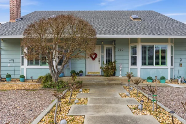 a front view of a house with garden