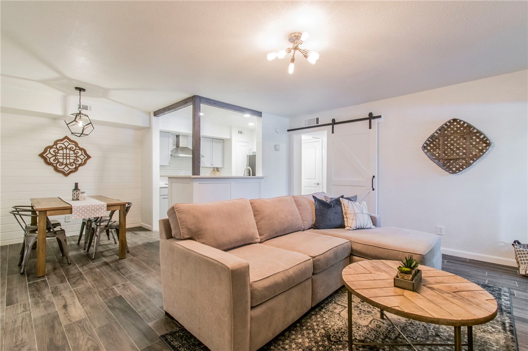 3204 Manchaca Road, Unit 103 Austin, TX 78704 - Photo 1 of 1 a living room with furniture and a wooden floor