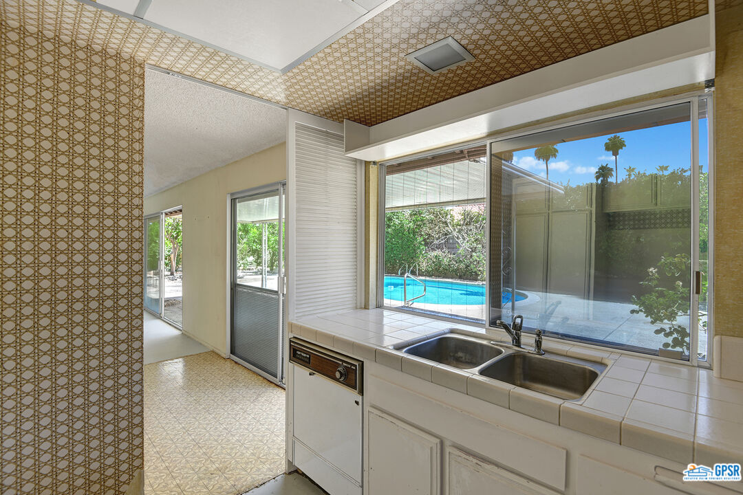2189 East Sonora Road Palm Springs, CA 92264 - Photo 12 of 29 a kitchen with a sink and large window
