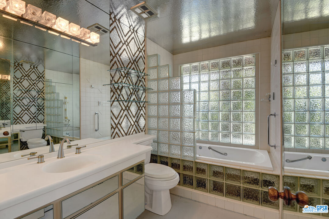 2189 East Sonora Road Palm Springs, CA 92264 - Photo 20 of 29 a bathroom with a sink a toilet and shower