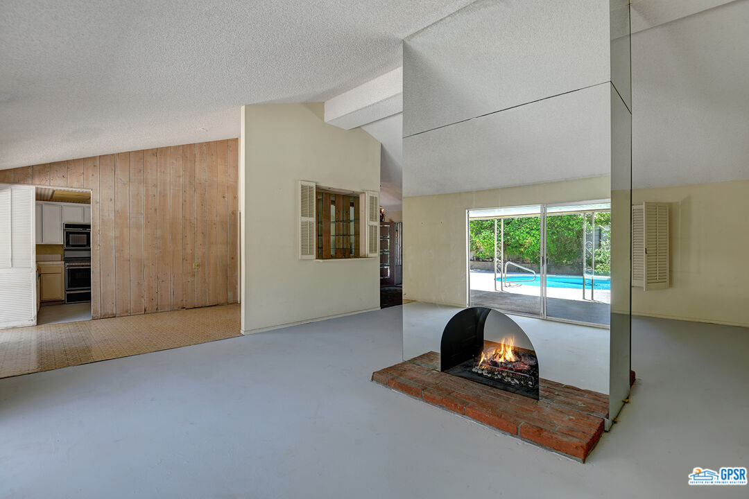 2189 East Sonora Road Palm Springs, CA 92264 - Photo 2 of 29 a living room with furniture and a large window