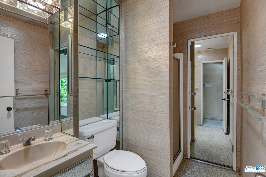 2189 East Sonora Road Palm Springs, CA 92264 - Photo 22 of 29 a bathroom with a sink toilet and shower