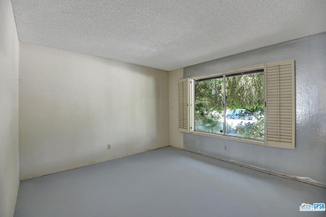2189 East Sonora Road Palm Springs, CA 92264 - Photo 25 of 29 an empty room with windows