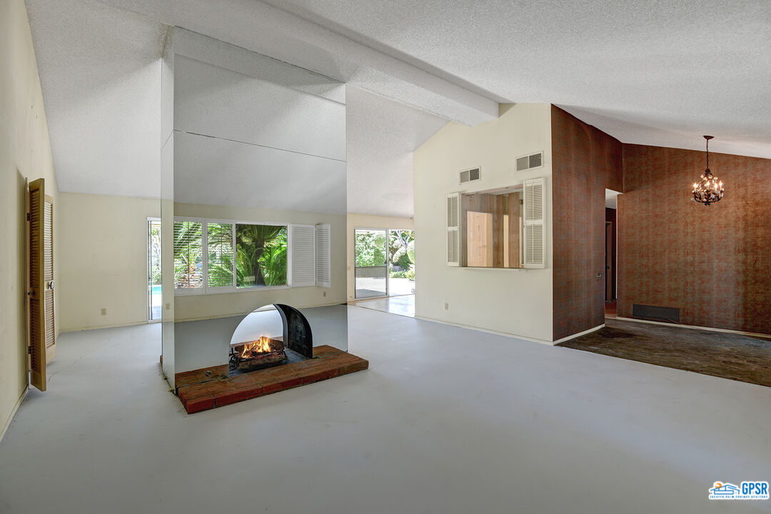 2189 East Sonora Road Palm Springs, CA 92264 - Photo 3 of 29 a living room with furniture and a window