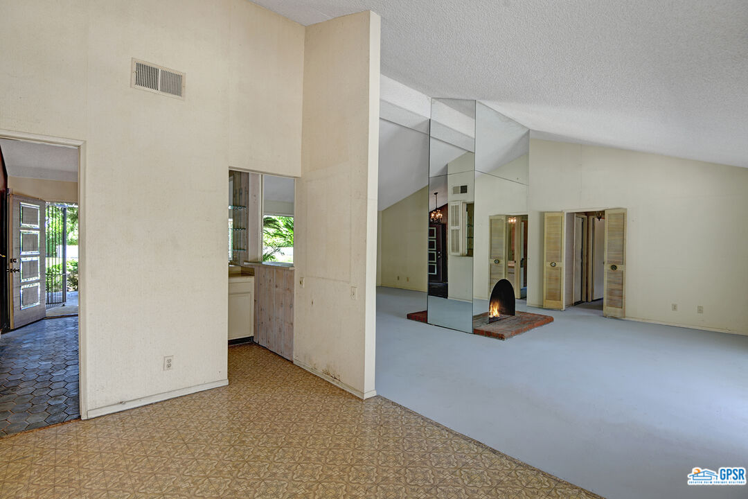 2189 East Sonora Road Palm Springs, CA 92264 - Photo 6 of 29 a view of a livingroom with furniture and floor to ceiling window