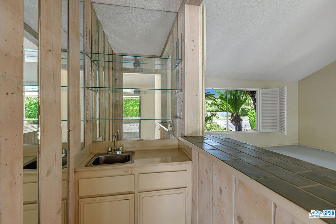 2189 East Sonora Road Palm Springs, CA 92264 - Photo 8 of 29 a kitchen with a sink and large window