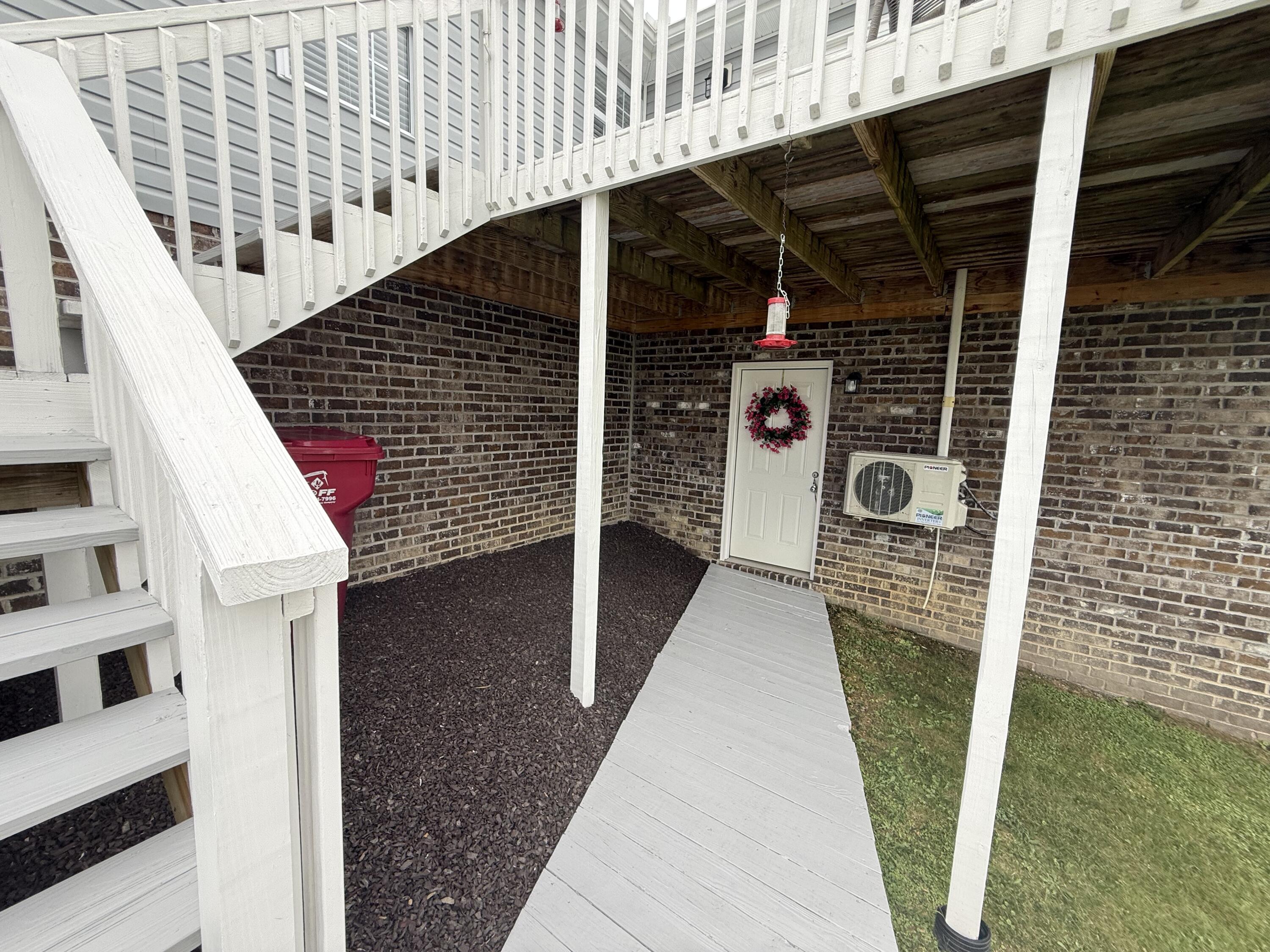 2409 Rooks Branch Road Keavy, KY 40737 - Photo 29 of 39 Deck, steps, and pathway leading to one car garage in basement