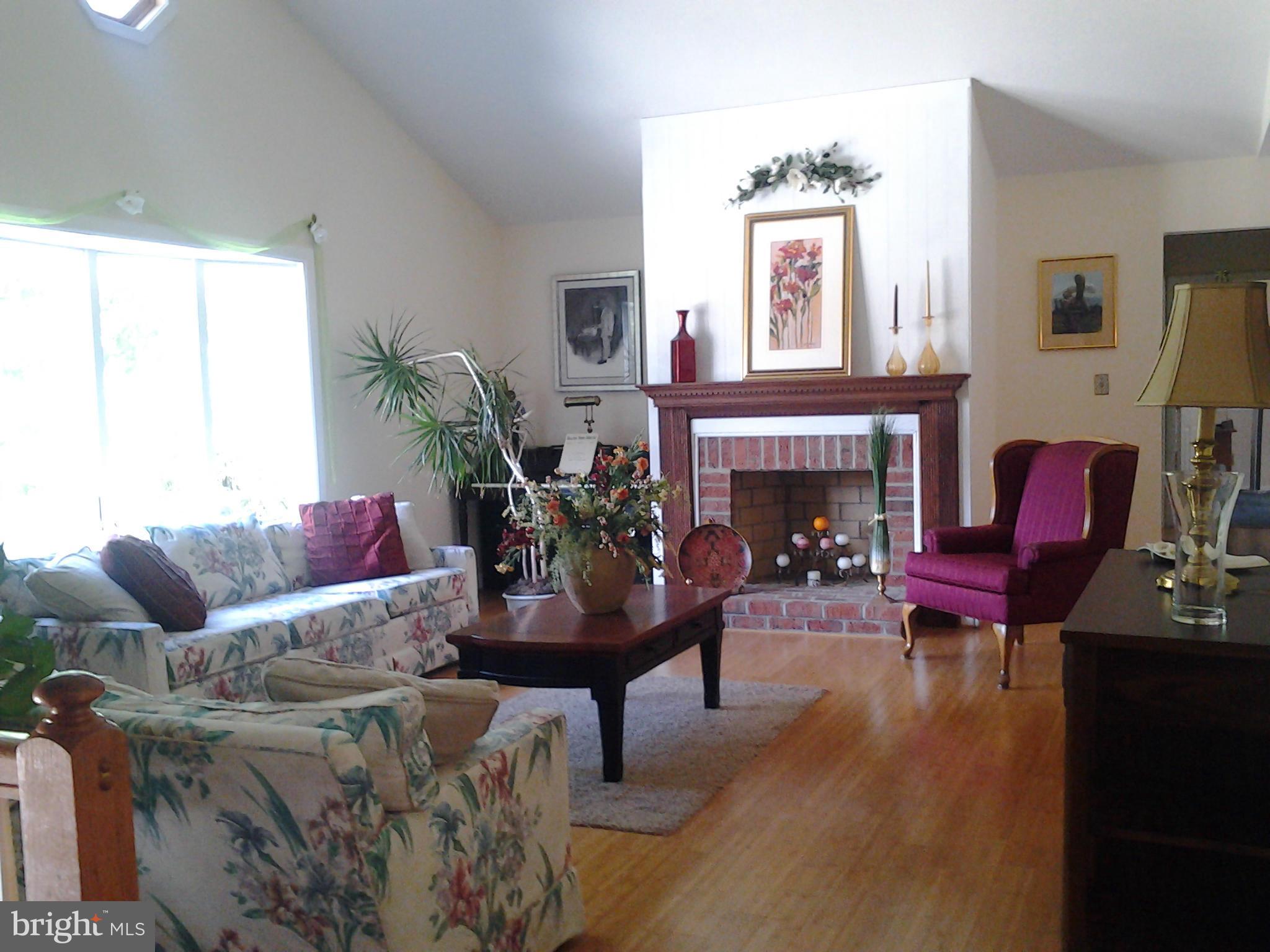 6709 Burch Hill Road Brandywine, MD 20613 - Photo 5 of 25 Living Room w/Cathedral Ceiling & Hardwood Floor