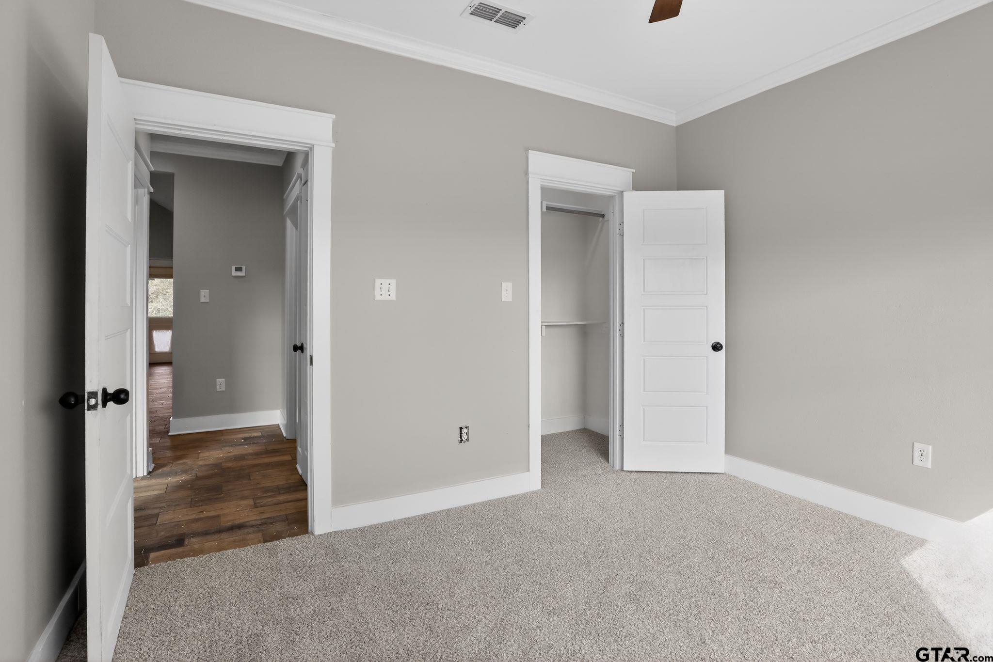 7600 County Road 210 Tyler, TX 75702 - Photo 17 of 30 wooden floor and closet area in a room